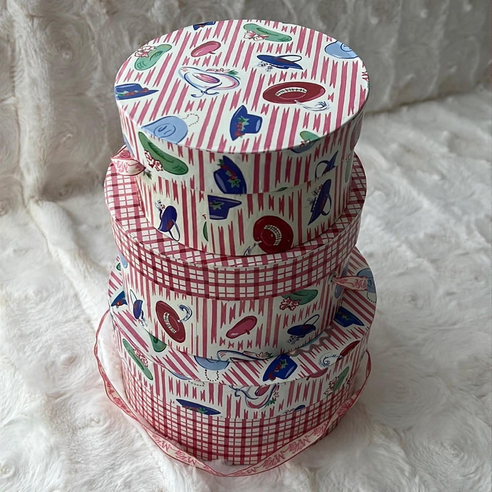 Stacked Muffy’s teddy bear hat boxes